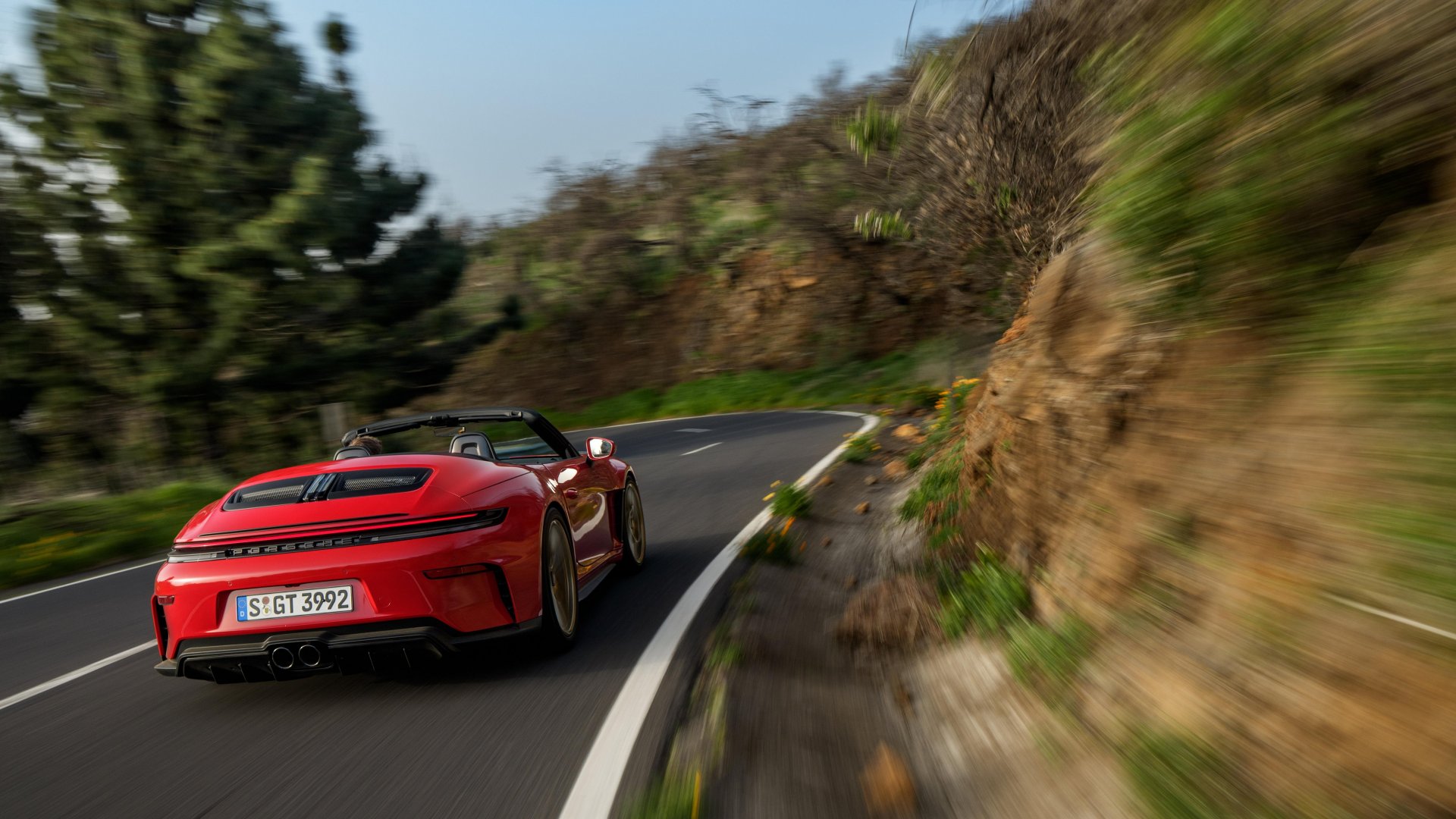 2027 Porsche 911 GT3 S/C — red, dynamic cornering shot